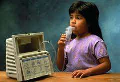 Young girl using nebulizer