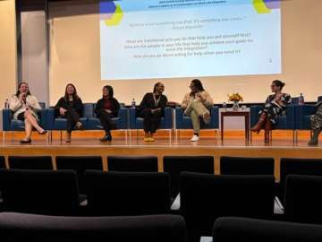 Group photo of panelists speaking aat 5th Annual DAPM Womxn's Symposium