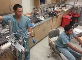 Ed Cheung, MD and Nirav Joshi, MD working in the lab.
