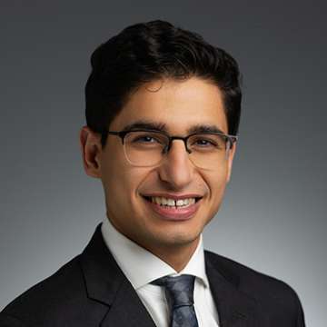 Head shot of Rafael Maarek, MD in a business suit, smiling at camera