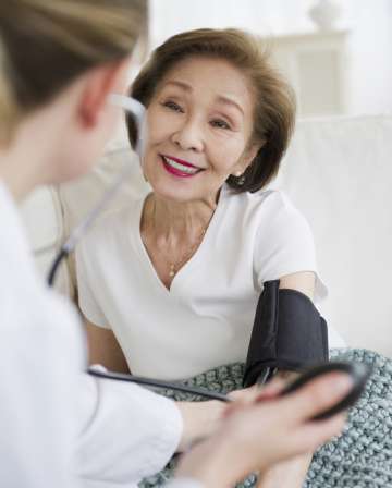 Patient having her blood pressure tested