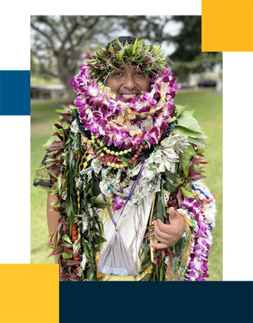 Jester Galiza wearing traditional leis and a lot of other plant wreaths.