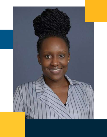 Iview Egiebor wearing a striped button down shirt and hair up in a bun