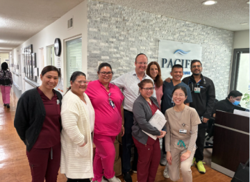 Medical team smiling at clinic reception