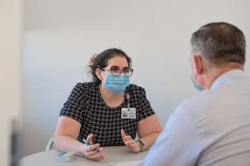 Female wearing glasses and face mask