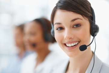 female with headphones in call center