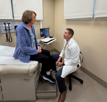 Patient speaking with doctor in room