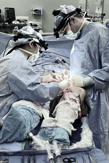 Doctors performing surgery on patient