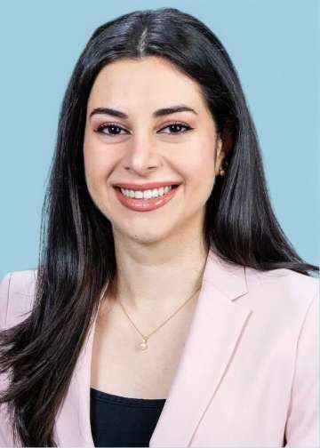Head shot of Natalie Nabaty in business attire, smiling at the camera