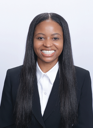 Head shot of Christina Ramsey in business attire, smiling at camera