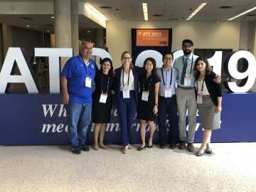 Research team in front of ATS 2019 sign