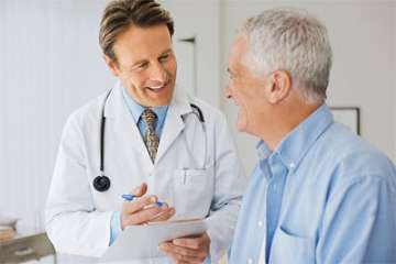 A pulmonologist speaking with an older patient