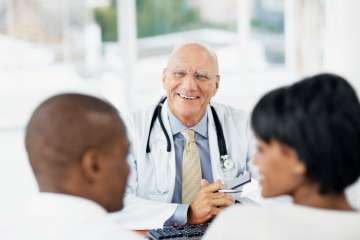 Doctor speaking to patients