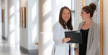 Gina Choi, MD with a student