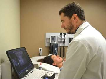 Dr. Gofnung with a patient