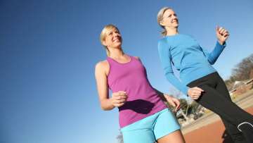 A couple women walking