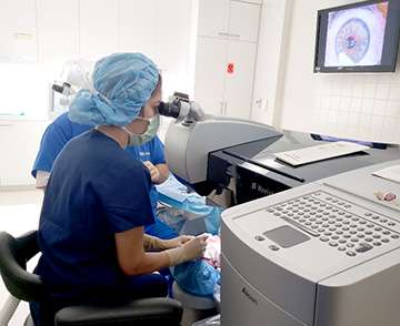 Dr. Nejad performs an excimer laser ablation after creating a LASIK flap.