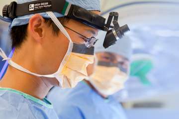 Male doctor performing surgery