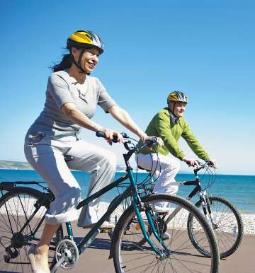 Two people riding bicyles