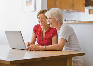Two woman using a laptop