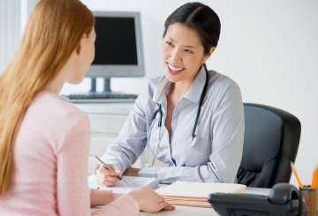 Female doctor speaking to a patient