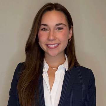 Head shot of Victoria Van Kirk, MD in business attire, smiling at camera.