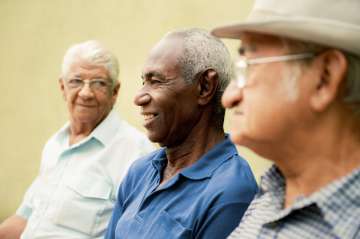 A group photo of seniors sitting and talking.
