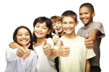 Group of kids smiling and giving a thumbs up