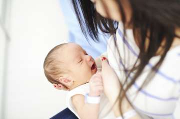 Woman breastfeeding her child