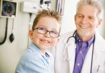Doctor and child smiling