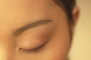 Woman with eye closed