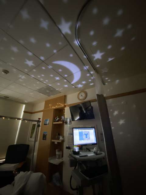 A night scene projected onto the hospital room ceiling