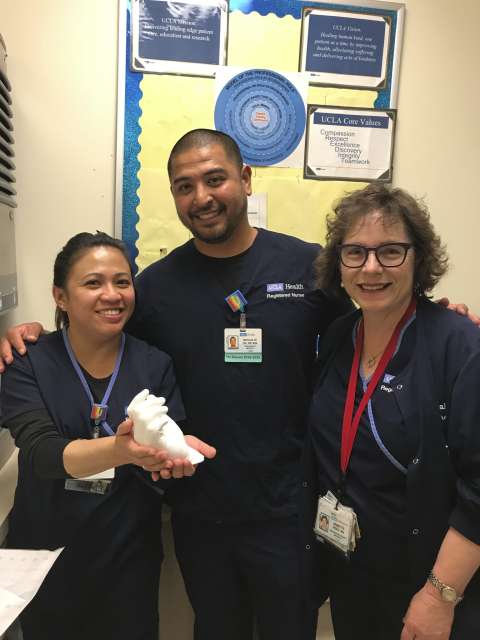 Night shift nurses with a hand mold