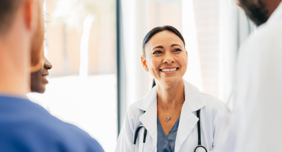 Female doctor speaking with her care team