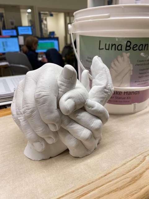 A hand casting of a family holding hands
