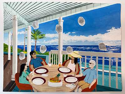 Group dining on a patio with ocean views in Hawaii, featuring a tropical table setting.