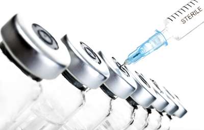 Syringe inserted into a vial