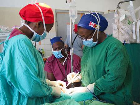 Doctors in Uganda operating