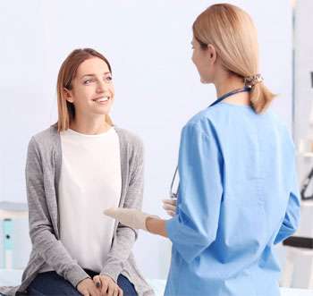 Woman and nurse speaking