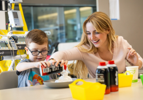 Influencer playing with a young patient