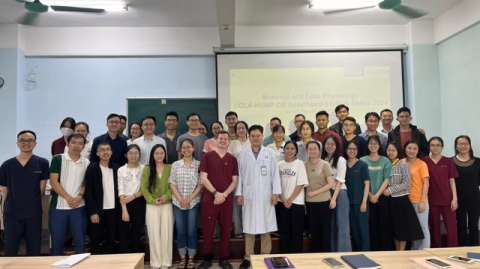 Dr. Jordan Francke with group of doctors while teaching in Vietnam