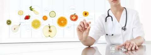 dietician holding floating fruits