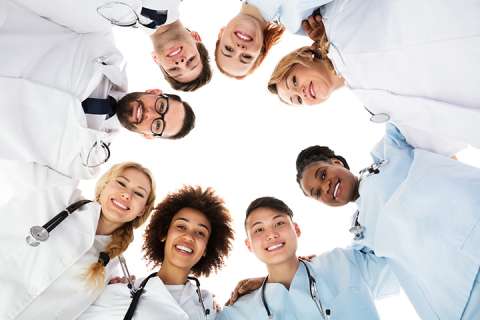 Doctors standing together in a circle