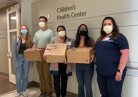 AYA Team members with wellness boxes