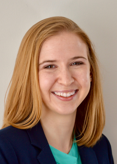  A headshot of Christine Willinger, a smiling woman with long blonde hair, wearing a dark blue blazer over a teal top.