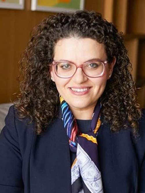 yelena vayner smiling in an indoor setting