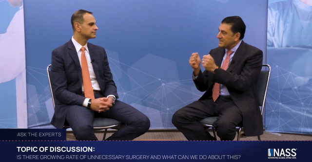 Two men sitting on chairs and discussing: if is there a growing rate of unnecessary surgery and what can be done about this?