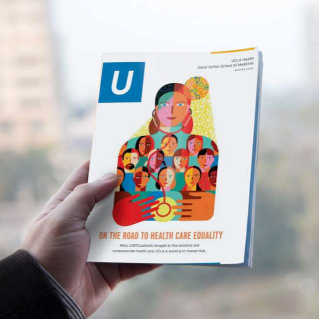 image of a hand holding a UCLA published book