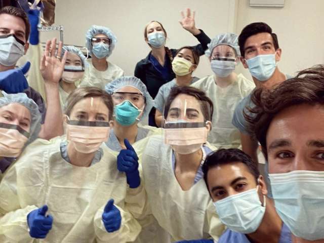 group photo of dermatology residents in anatomy lab
