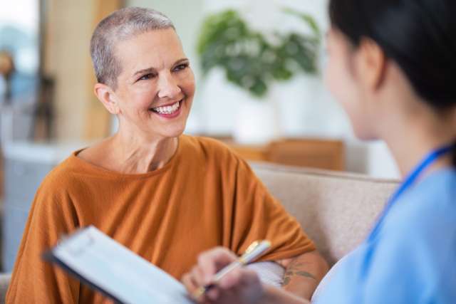 Cancer patient talking to a nurse